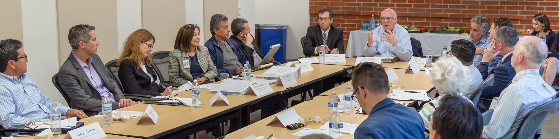 Supervisor Simitian sitting at a conference table moderating a discussion on various issues.